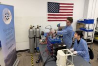 Engineers work on hardware in Interlune's Regolith Lab